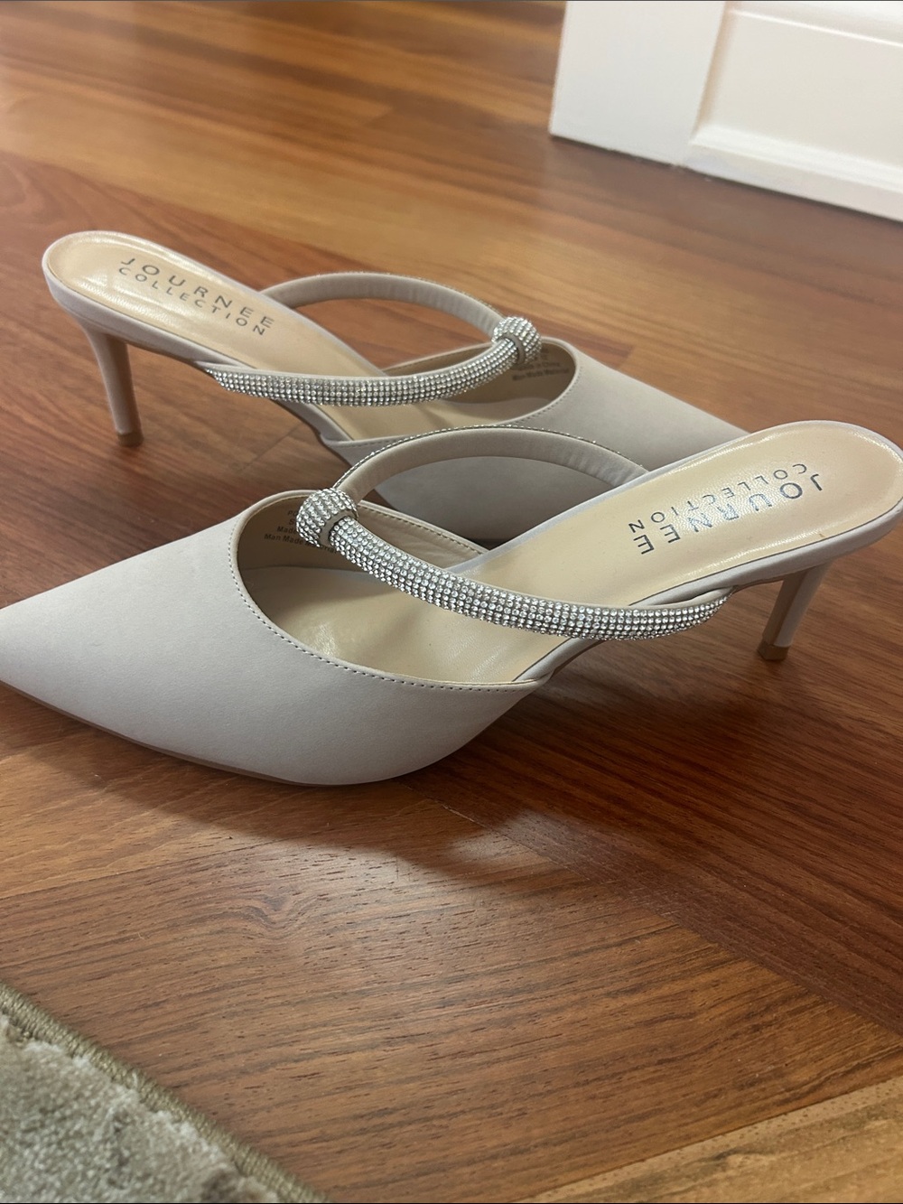 Nude mule heels with rhinestone strap